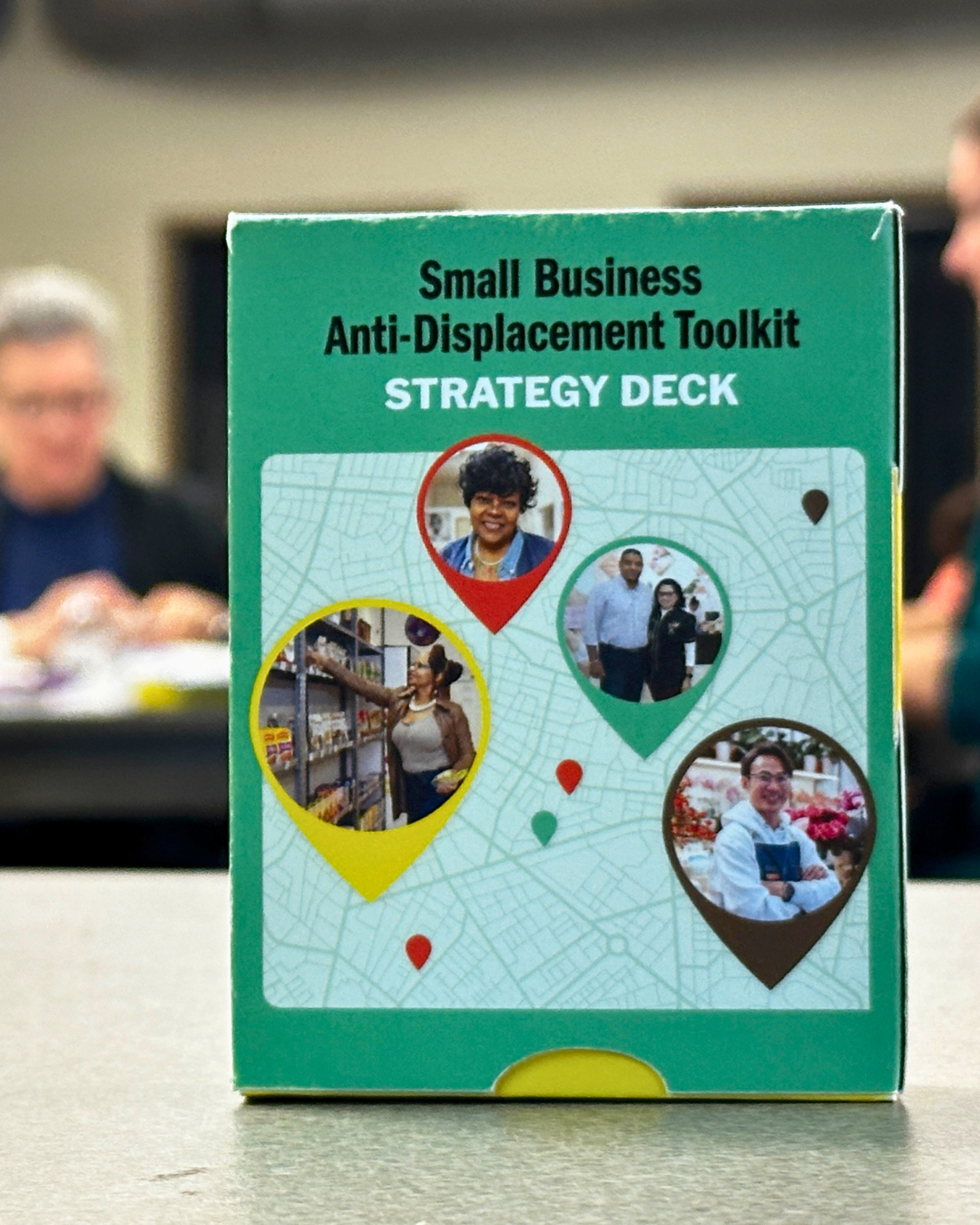 a worn-out copy of the SBAN strategy deck sits on a table.